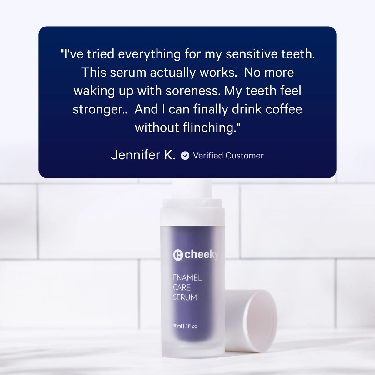 A bottle of cheeky Enamel Care Serum with its cap beside it on a white marble surface, set against a white tiled background. A large dark blue testimonial card with customer review text is positioned above the product.