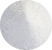 A close-up circular view of a white granular powder or fine solid material filling the frame.